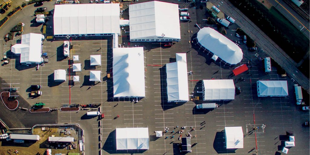 Multi-structure festival event venue with tents and production infrastructure